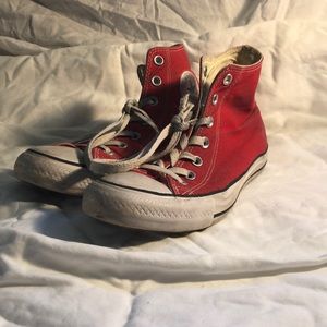 Well loved red high top converse